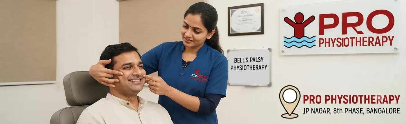 Bell's palsy physiotherapy at Pro Physiotherapy JP Nagar 8th Phase Bangalore — female MPT physiotherapist delivering facial neuromuscular re-education, mirror therapy and PNF facilitation for a smiling seated patient recovering from facial palsy