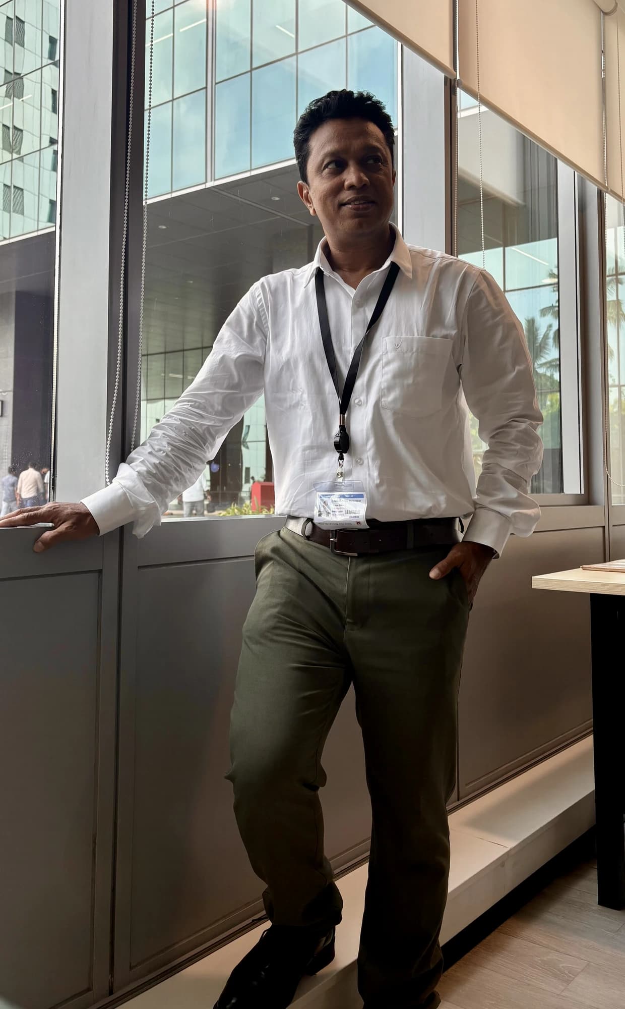 Dr J Mazumdar (PT), FIFA Diploma in Sports Medicine — Founder & Lead Physiotherapist at Pro Physiotherapy JP Nagar 8th Phase Bengaluru, photographed at Manyata Tech Park during a corporate wellness engagement