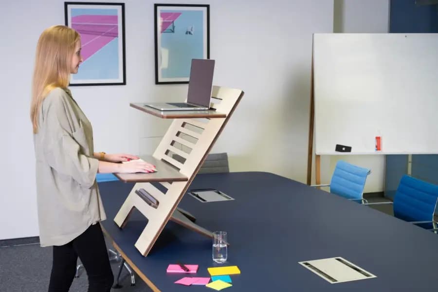 Ergonomic Setup Tips Remote Workers Bangalore WFH Ergonomic setup tips for remote workers Bangalore — WFH standing desk with monitor at eye level, external keyboard and ergonomic chair by Pro Physiotherapy JP Nagar corporate audit