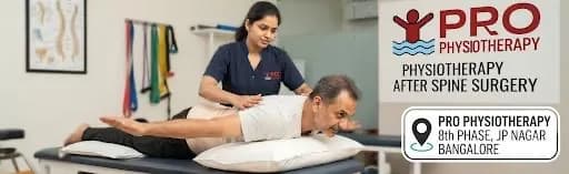 Physiotherapy After Spine Surgery in Bangalore | 12-Week Safe Post-Op Recovery | Pro Physiotherapy JP Nagar Physiotherapy after spine surgery at Pro Physiotherapy JP Nagar 8th Phase Bangalore — female MPT physiotherapist guiding a prone male patient through spine-safe log-roll and post-laminectomy mobility drill, home-visit post-surgical rehab